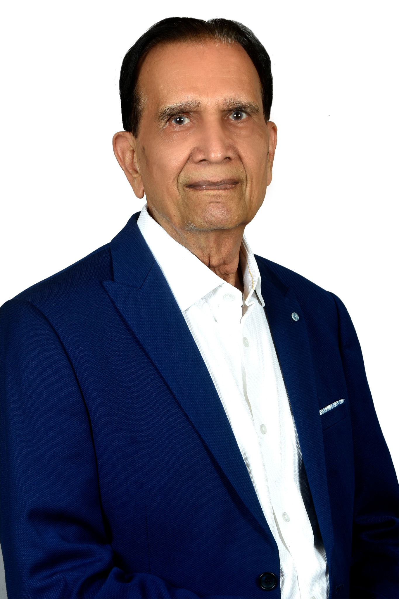 Ram Niwas Rander in a navy blazer and open-collar white shirt